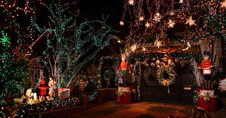 A vibrant Christmas lights display featuring decorations and nutcracker figures in a New York neighborhood.