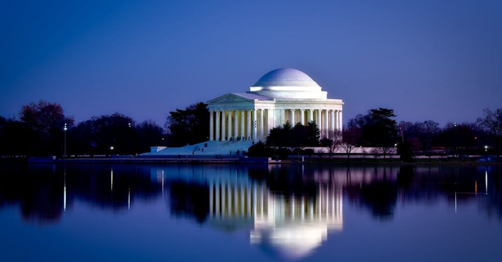 Stunning view of the Jefferson Memorial reflecting in water during twilight in Washington DC.