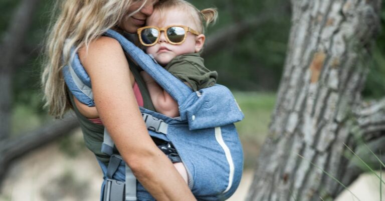 A loving mother embraces her children in a serene outdoor environment, highlighting family bonding.