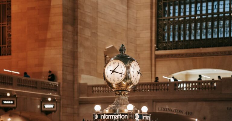 Interior of Grand Central Terminal featuring its iconic clock over the information booth.