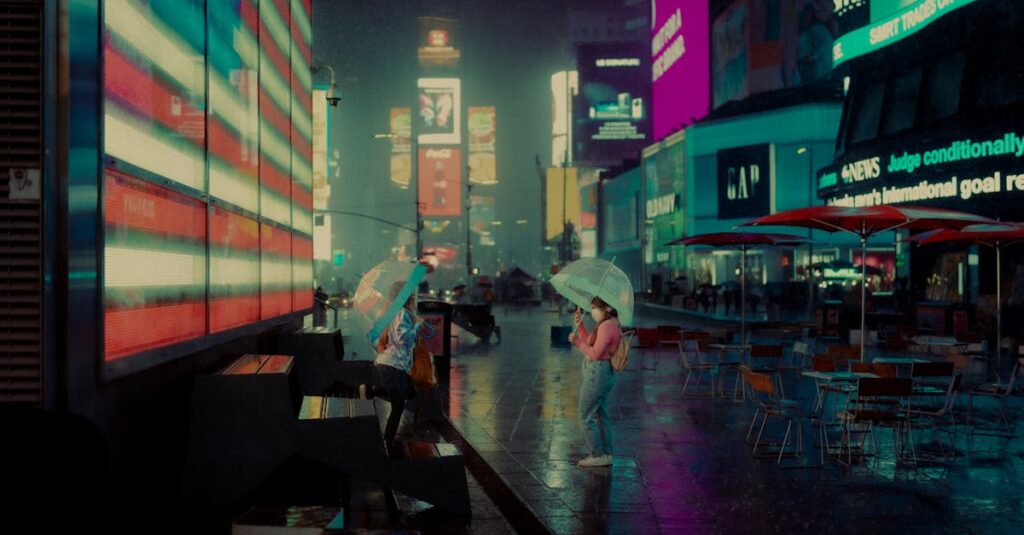 Two people with umbrellas in rainy Times Square, New York, illuminated by bright digital billboards.